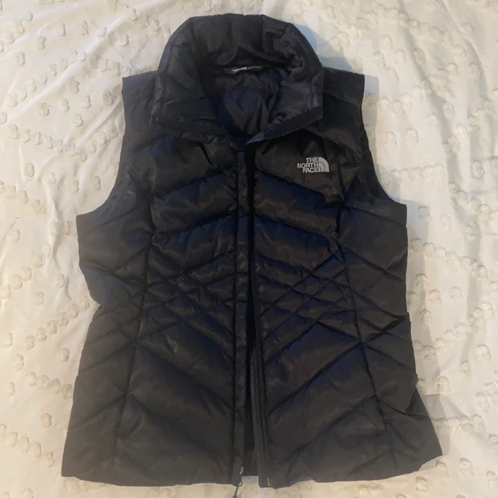 Women’s black North Face vest in like-new condition. Size small.